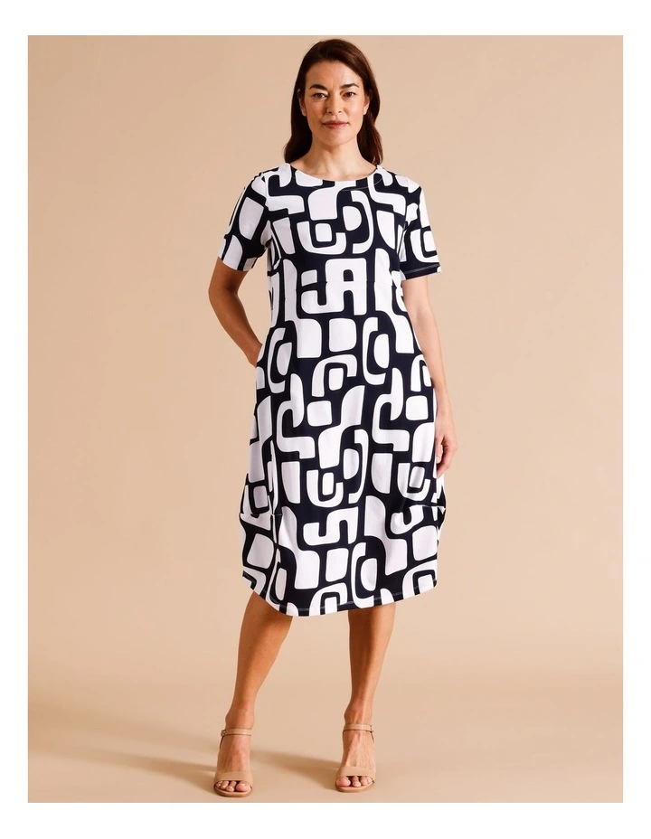 Organic Cotton Short Sleeve Knit Dress With Darted Hem And Pockets In Navy/ White Abstract