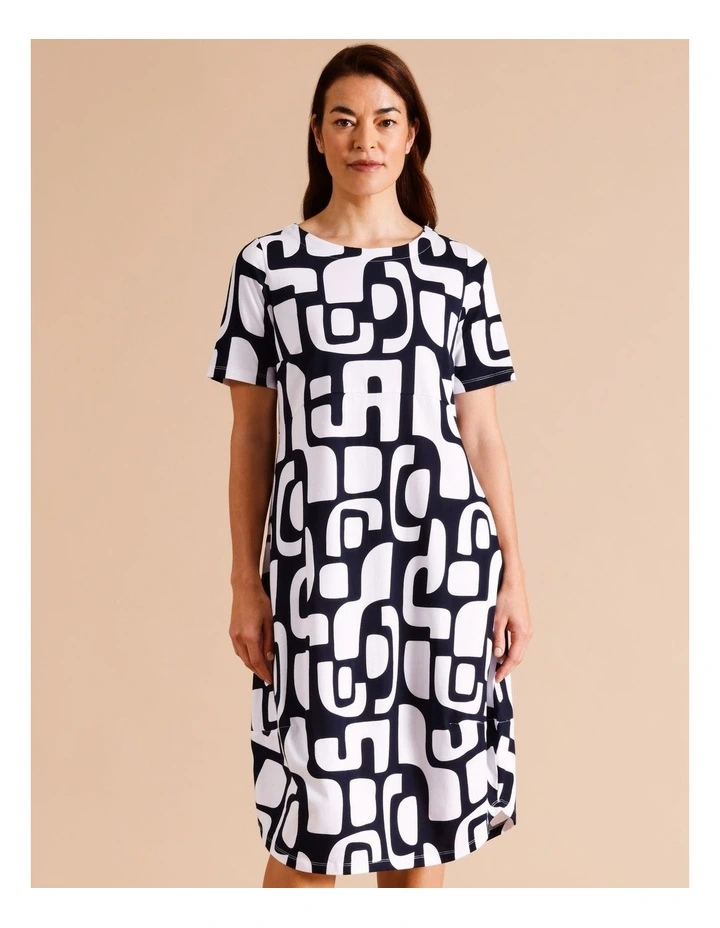 Organic Cotton Short Sleeve Knit Dress With Darted Hem And Pockets In Navy/ White Abstract