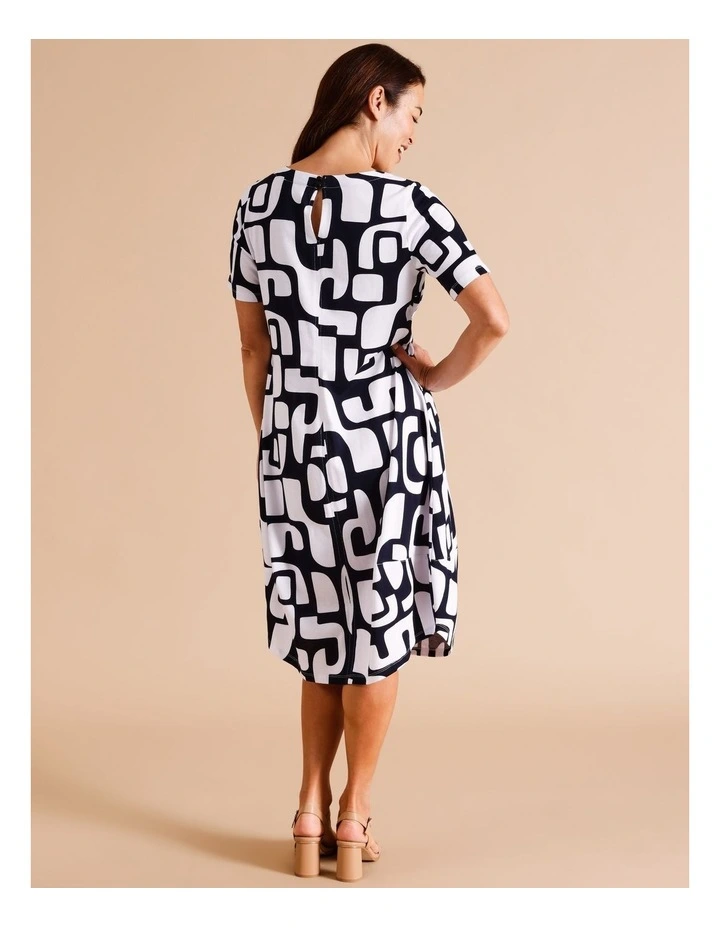 Organic Cotton Short Sleeve Knit Dress With Darted Hem And Pockets In Navy/ White Abstract