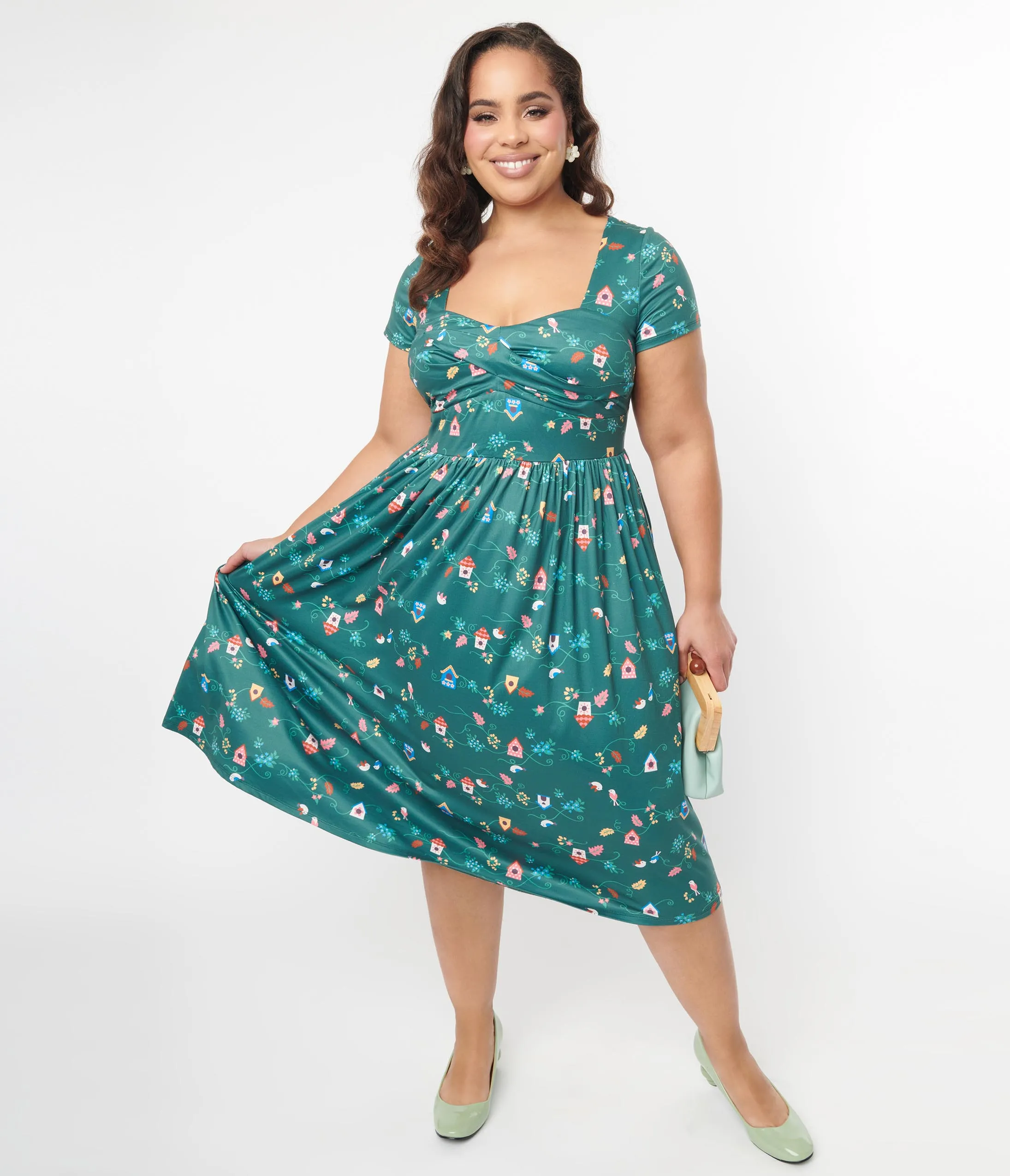 Unique Vintage Plus Size 1950s Green Birdhouse Twist Front Swing Dress