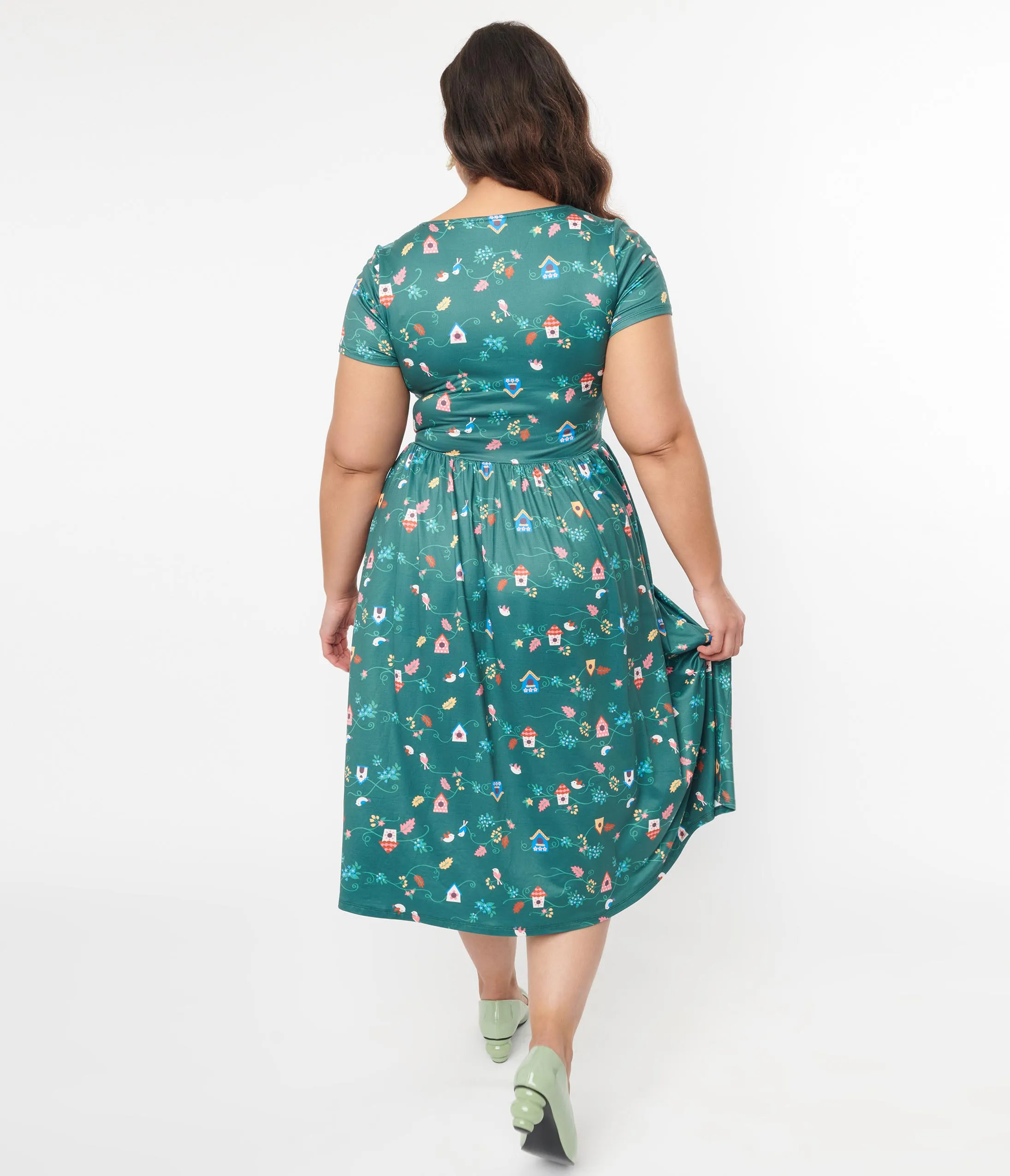 Unique Vintage Plus Size 1950s Green Birdhouse Twist Front Swing Dress