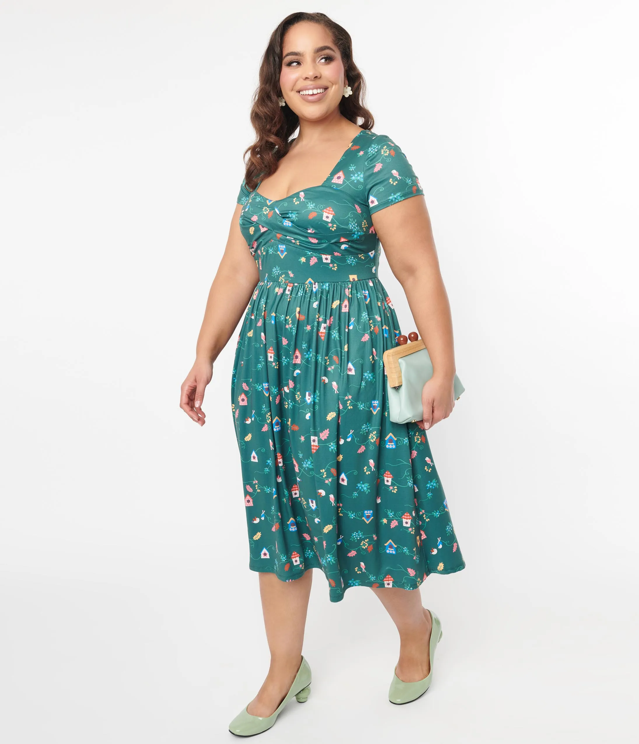 Unique Vintage Plus Size 1950s Green Birdhouse Twist Front Swing Dress