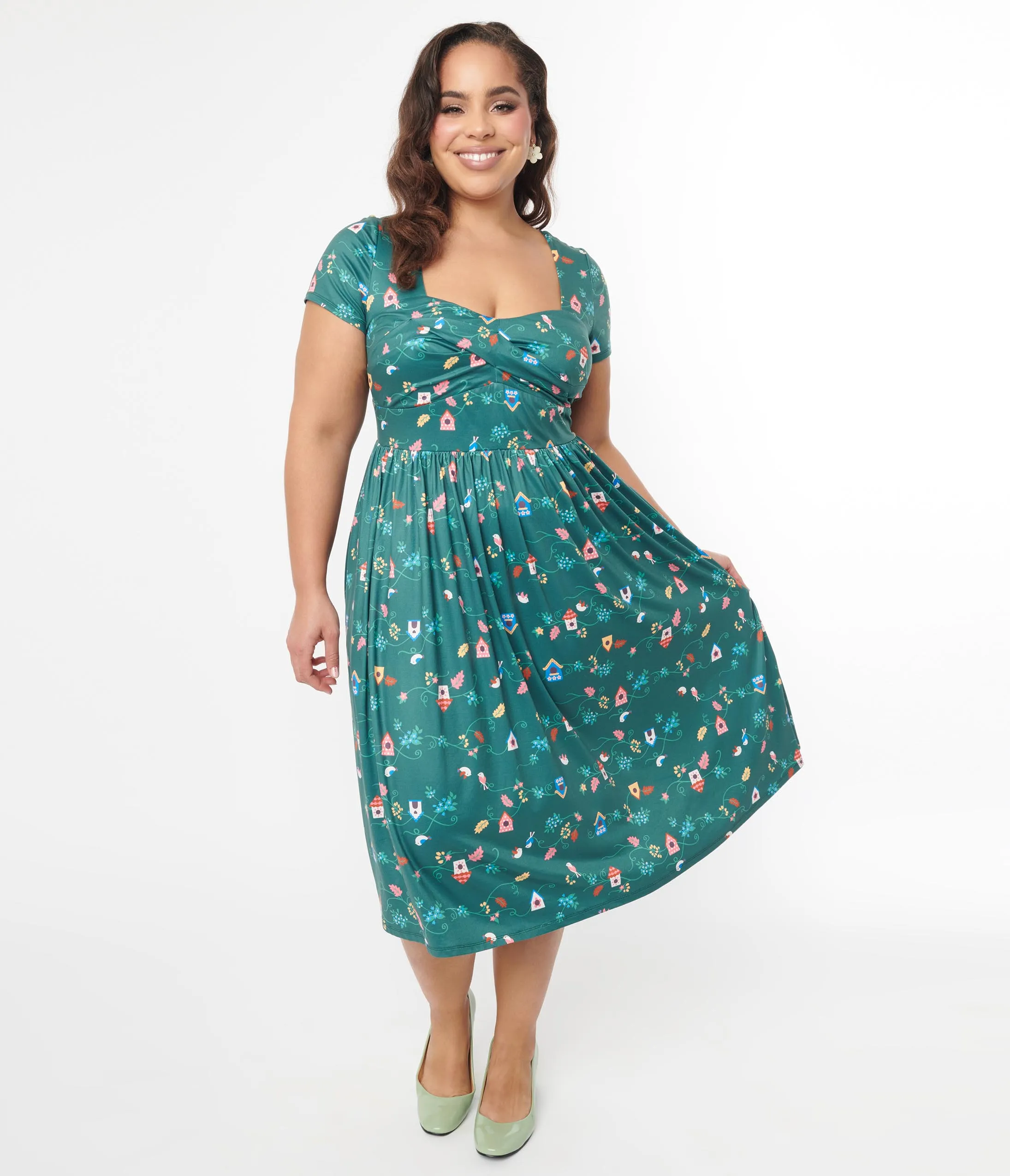 Unique Vintage Plus Size 1950s Green Birdhouse Twist Front Swing Dress